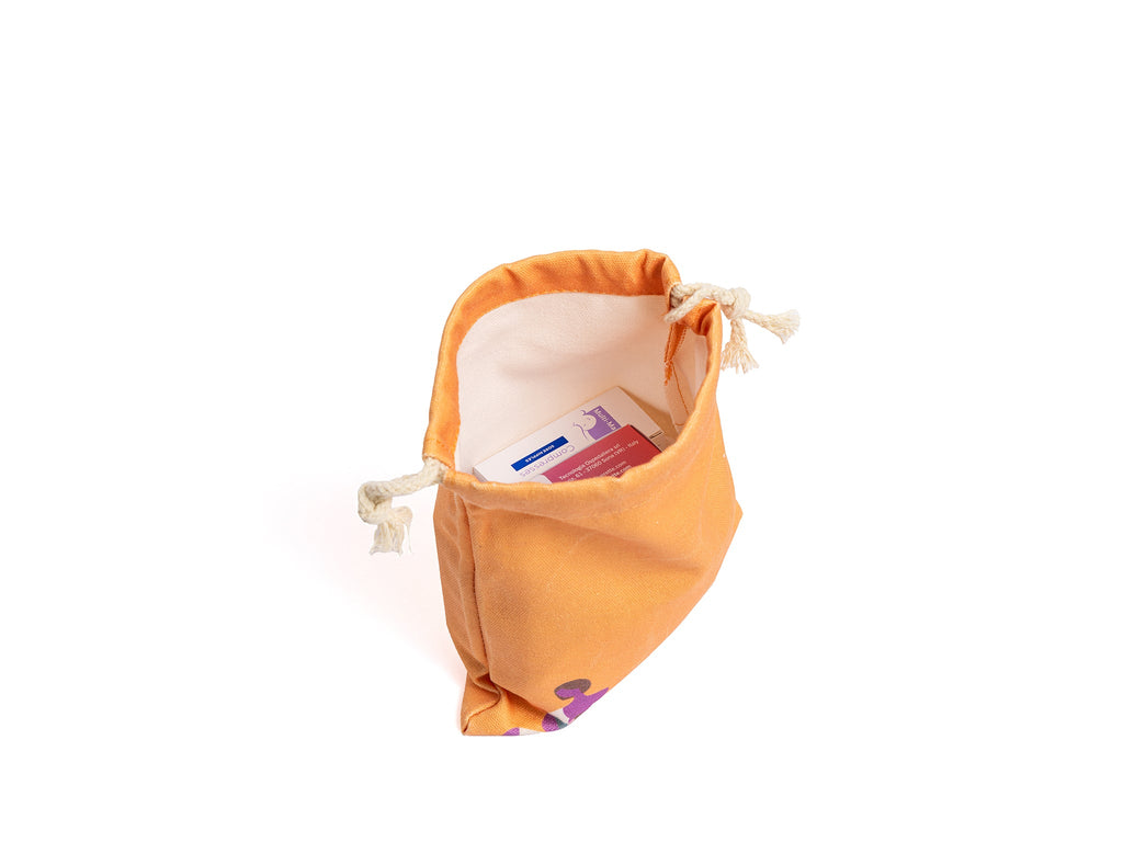 Mama's Breastfeeding Bag opened with breastfeeding essentials and a drawstring